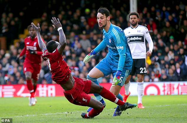 Goalkeeper Sergio Rico (center) pictured during Fulham's match against Liverpool in 2019