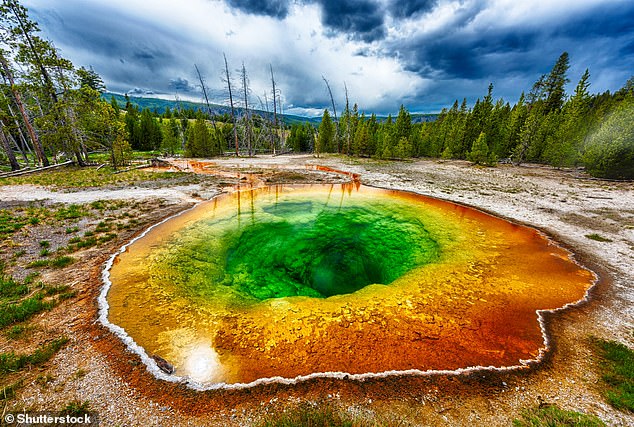 The once crystal blue water of Yellowstone Park's Morning Glory Pool has turned multi-colored due to careless tourist habits