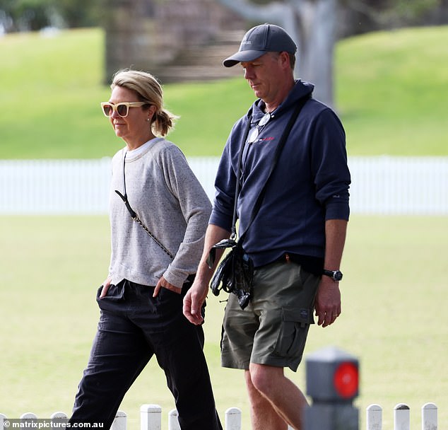 The journalist appeared dejected as she strolled with her husband Tim Baker as they took their dog for a walk through a leafy local park