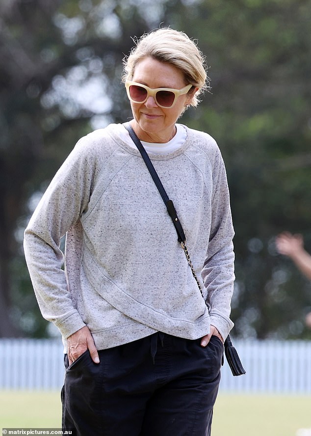 Channel Nine veteran Georgie Gardner cut a somber figure on Saturday as she was seen walking her dog outside her home in the upmarket Sydney suburb of Mosman