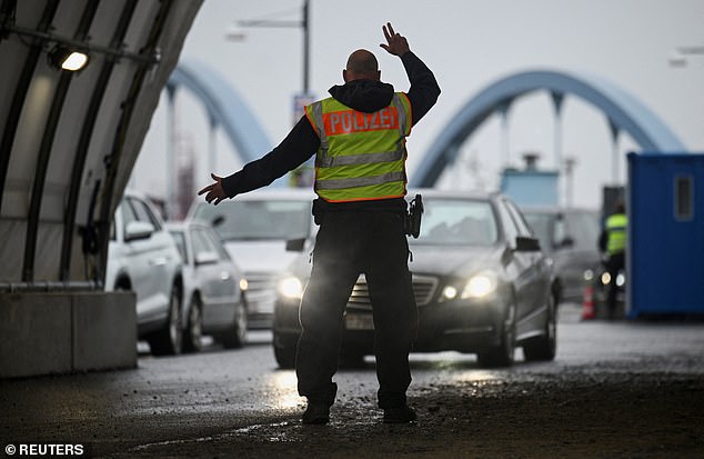 Police at the German-Polish border monitor traffic as stricter border controls are introduced