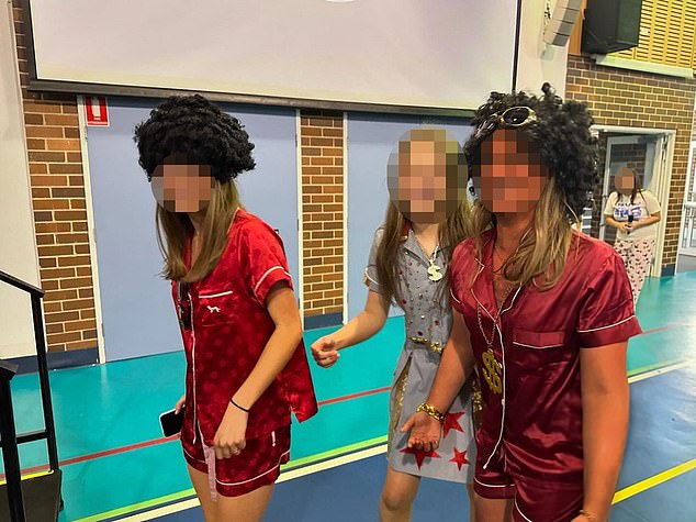 Photos of two girls at an exclusive private school for girls have been removed to avoid 'misinterpretation', the headmaster says