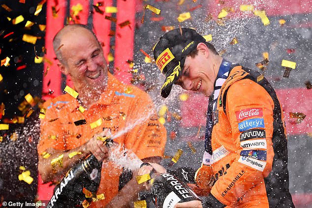 Piastri celebrates his second F1 victory with McLaren race engineer Tom Stallard after taking the chequered flag in Baku last weekend