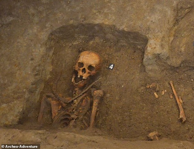 Archaeologists have discovered a grave in a Polish church containing a 'vampire' with a sickle around his neck to prevent him from 'returning from the dead' under a stone with a skull engraving