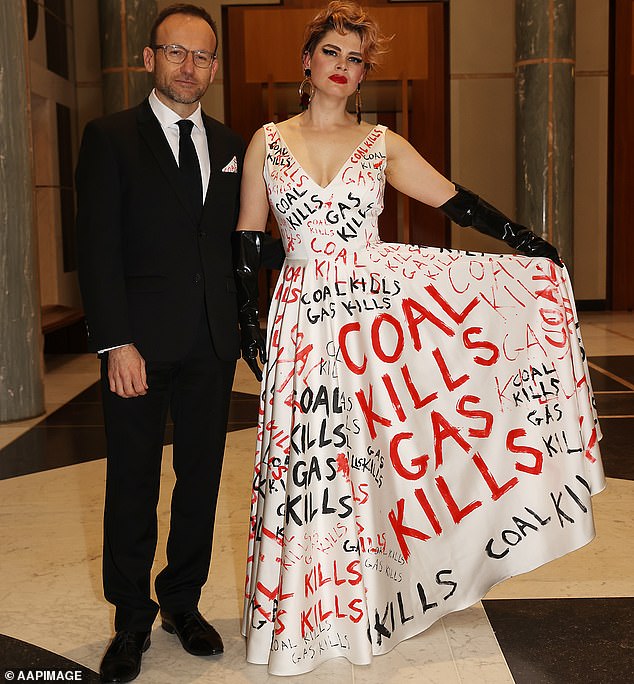 The Greens want an immediate ban on the construction of new coal, oil and gas infrastructure, which the party believes will move the economy towards a carbon-free energy supply. Pictured: Greens leader Adam Bandt and his partner Claudia Perkins