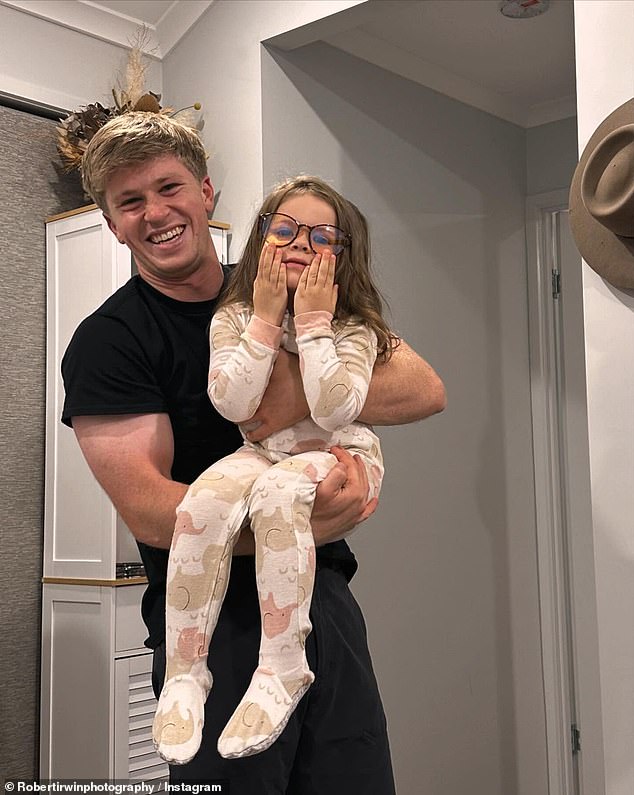 Robert Irwin has sent his fans into a frenzy by sharing a stunning photo of himself showing off his bulging biceps while spending time with his niece Grace. He is smiling in the adorable photo as he shows off his toned and bulging biceps. Both are pictured