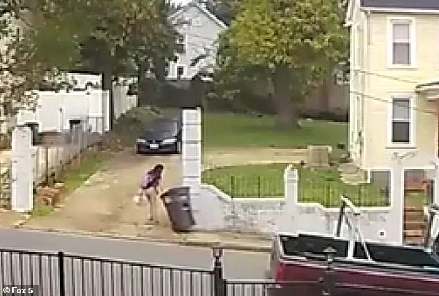 Terrifying surveillance video shows a 13-year-old girl dragging a trash can into the driveway of her home moments before police say her mother shot her in the neck