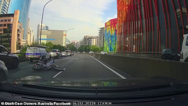 Dashcam shows the bike bouncing off the concrete barrier in the middle of the road