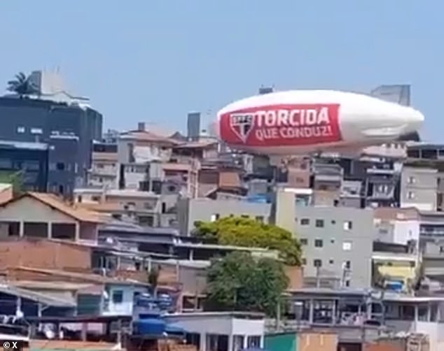 An airship advertising Brazilian soccer team São Paulo FC's Copa Libertadores match crashed into several homes in the southeastern Brazilian city of São Paulo on Wednesday night. The airship's pilot was rescued by firefighters and taken to a local hospital