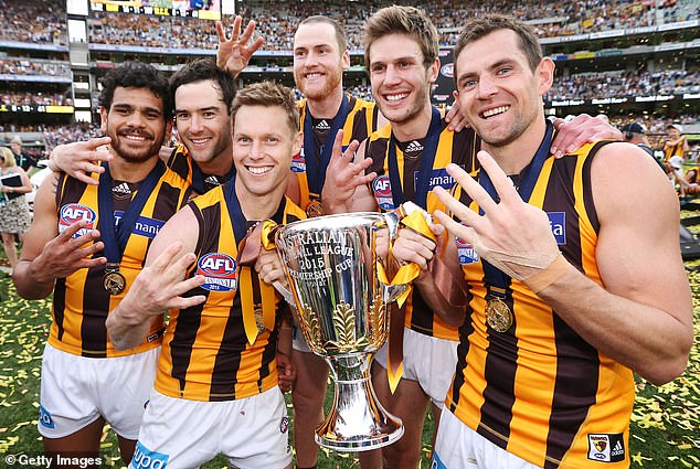 Sam Mitchell has dismissed Luke Hodge's claim that Jack Ginnivan's recent social media activity could propel Port Adelaide into their upcoming AFL semi-final (Mitchell and Hodge pictured after winning the 2015 AFL Grand Final)