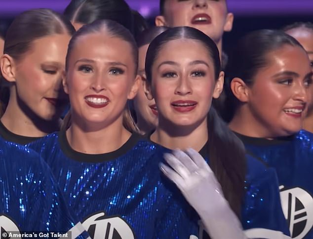 A friend placed a reassuring hand on Emily's shoulder as AGT judge Howie Mandel sat with his arms crossed for his devastating verdict