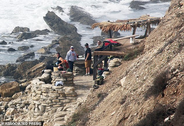 The surf gang 'Bay Boys', who have been known for terrorizing beachgoers and other surfers for decades, have finally learned their fate after allegedly bullying people out of Lunada Bay for decades. (Pictured: the rock fort the group built at the foot of the cliff)