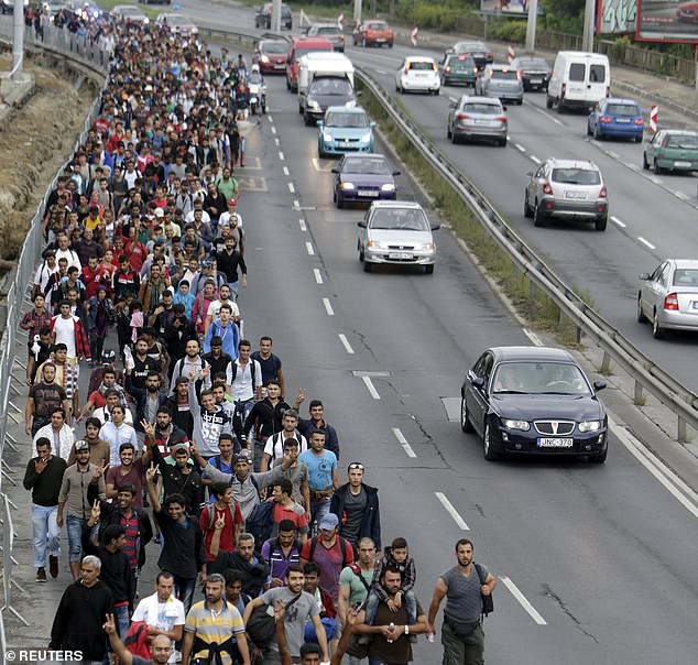 Migrants walk through a street from Keleti train station in Budapest, Hungary in September 2015 (file photo)