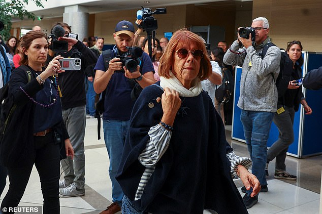 Gisele Pelicot, who was allegedly drugged and raped by men approached by her husband Dominique Pelicot, walks into a courthouse in Avignon, France, Sept. 10