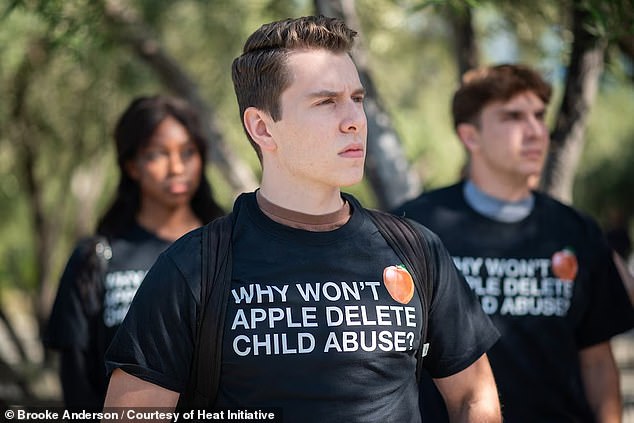 Above, Haynes attends a protest today at Apple headquarters in Cupertino, California. A 20-year-old college student, Haynes has come forward to tell his story in an effort to pressure Apple to work harder to implement better child protection features in its tech products.