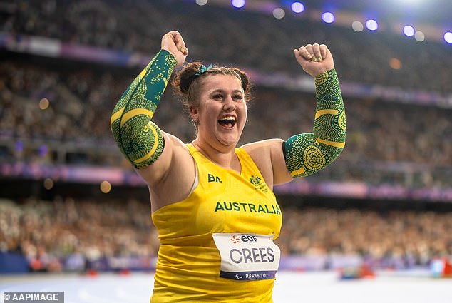 Cress celebrates her bronze javelin win after breaking her personal record