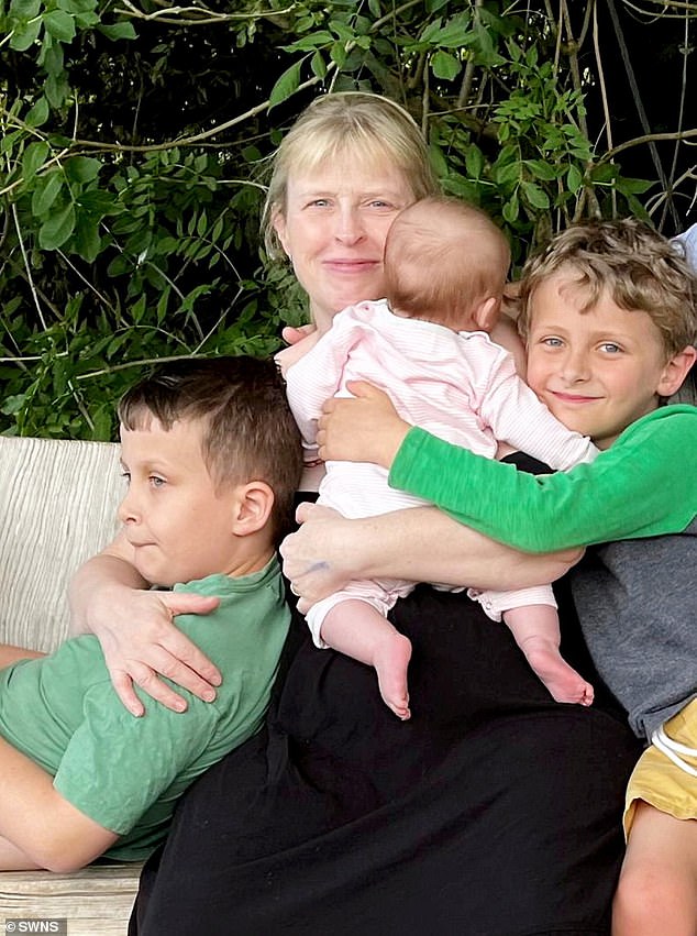 Beth Hobson, 55, from Manchester, started IVF 15 years ago despite being told she had only a 10 per cent chance of becoming pregnant naturally – pictured with her three children