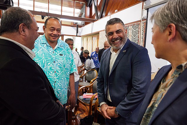 Justin Mohamed earns a salary of between $240,000 and $326,000 a year, according to DFAT officials who spoke at a Senate hearing (he is pictured with Foreign Minister Penny Wong, both right, at a forum in Fiji in August).