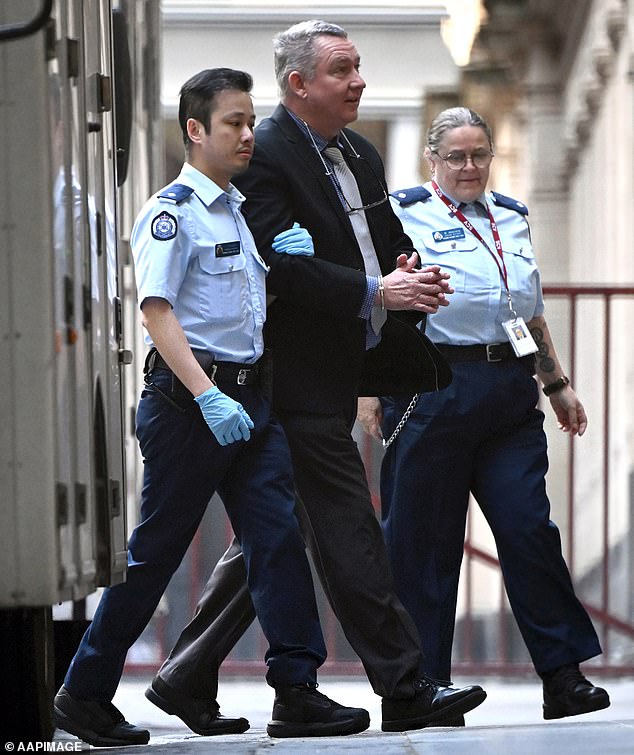 Greg Lynn enters the Victorian Supreme Court in handcuffs on Wednesday, facing life behind bars for the murder of Carol Clay