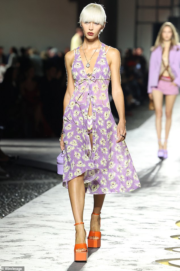 Iris Law also took to the catwalk, showing off her model figure in a flowing, sheer purple dress with yellow flowers