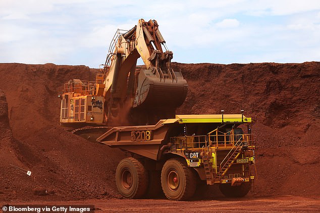 The price of Australia's largest export is expected to continue falling, depriving governments of much-needed revenue during an economic recession (pictured is a Fortescue mine in the Pilbara)