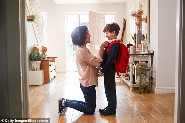 Fall: the season when social media is flooded with portraits of the start of the school year, children on the sidewalk wearing oversized blazers and overly shiny shoes (stock image)