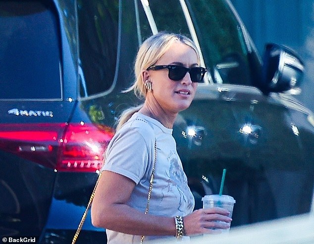 Jackie 'O' Henderson kept a low profile as she was spotted leaving Kyle Sandiland's ultra-luxurious Los Angeles rental home on Wednesday