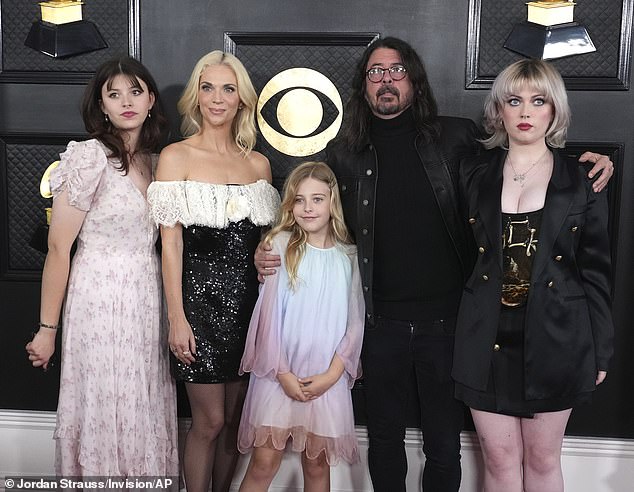 Grohl and his wife Jordyn have three daughters - Violet, Harper and Ophelia (pictured at the 2023 Grammy Awards)