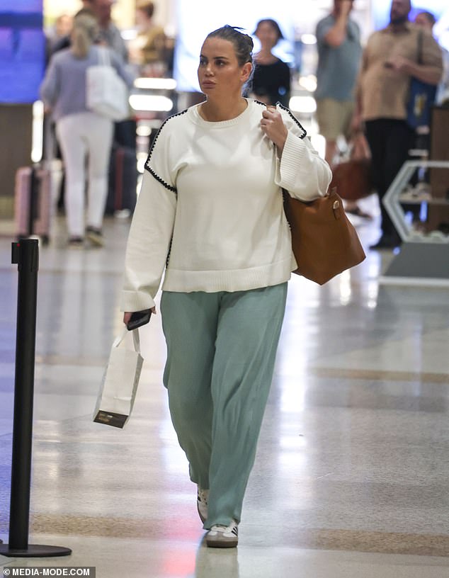 The popular Nine TV presenter, 41, was spotted walking through Sydney Airport's domestic terminal in casual attire on Wednesday night after a long day of lecturing