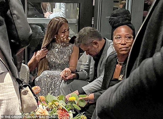 The 55-year-old Jenny From the Block singer and the 53-year-old Bourne Identity star sat with their heads close together and serious expressions in a corner of the party where they could have some privacy.