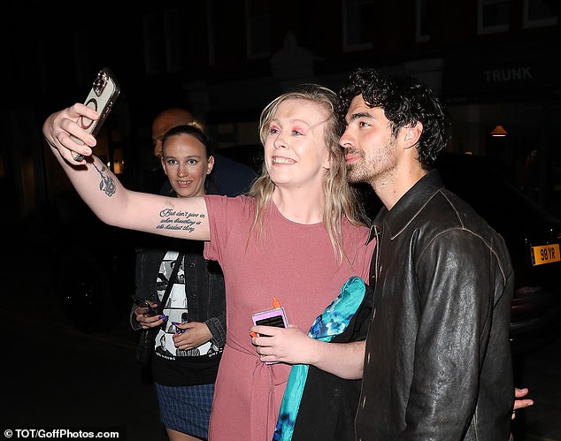 Joe Jonas was mobbed by a group of fans as he and his brother Kevin enjoyed a night out at the Chiltern Firehouse in London after the concert on Tuesday night