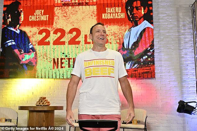 Joey Chestnut defeated rival Takeru Kobayashi in a hot dog eating contest on Netflix on Monday