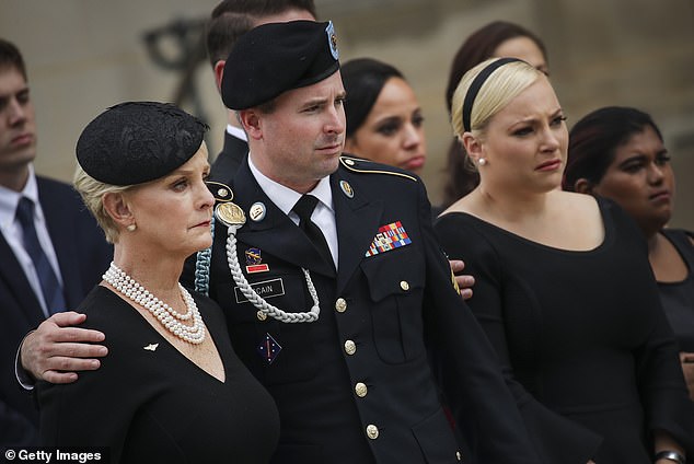 Jimmy McCain (with mother Cindy and sister Meghan McCain) criticized Donald Trump's campaign behavior at Arlington Cemetery and called for 'show respect and leave'