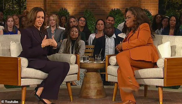 Kamala Harris and Oprah Winfrey speak at a political forum in Michigan