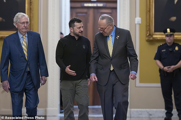 Ukrainian President Volodymyr Zelenskyy (center) walks with Senate Minority Leader Mitch McConnell, R-Ky., left, and Senate Majority Leader Chuck Schumer, D-N.Y.