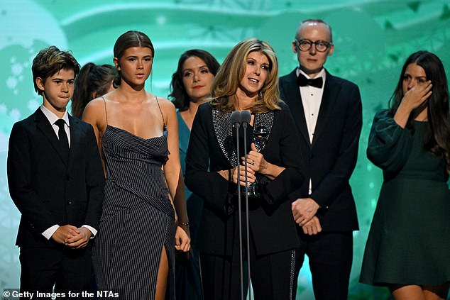 To accept her award, Kate was joined on stage by her and Derek's children Darcey, 18, and Billy, 15