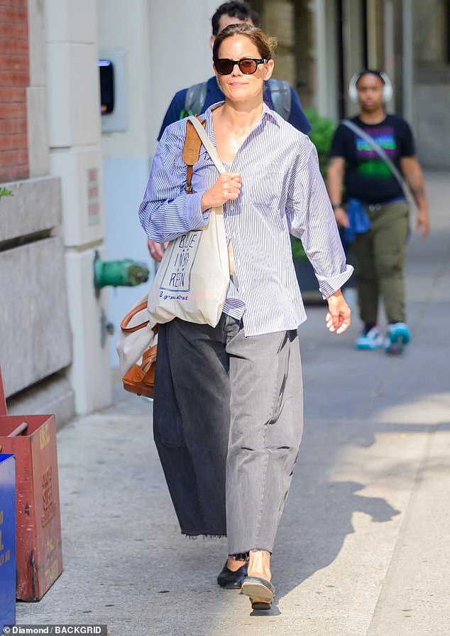 Katie Holmes, 45, stepped away from her usual casual chic style and appeared to try out a very different look as she ran errands in New York City on Friday