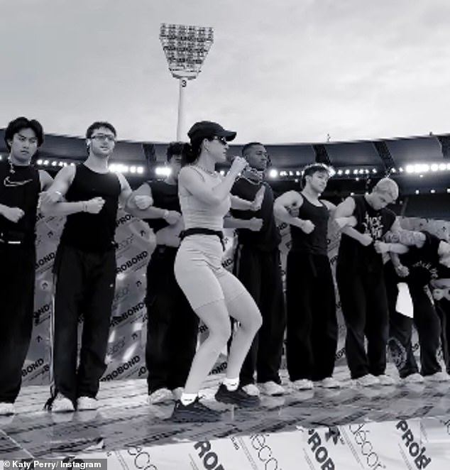 Katy Perry has given fans a behind-the-scenes look at her highly anticipated AFL Grand Final performance as she rehearsed with dancers (pictured) just hours before the big performance