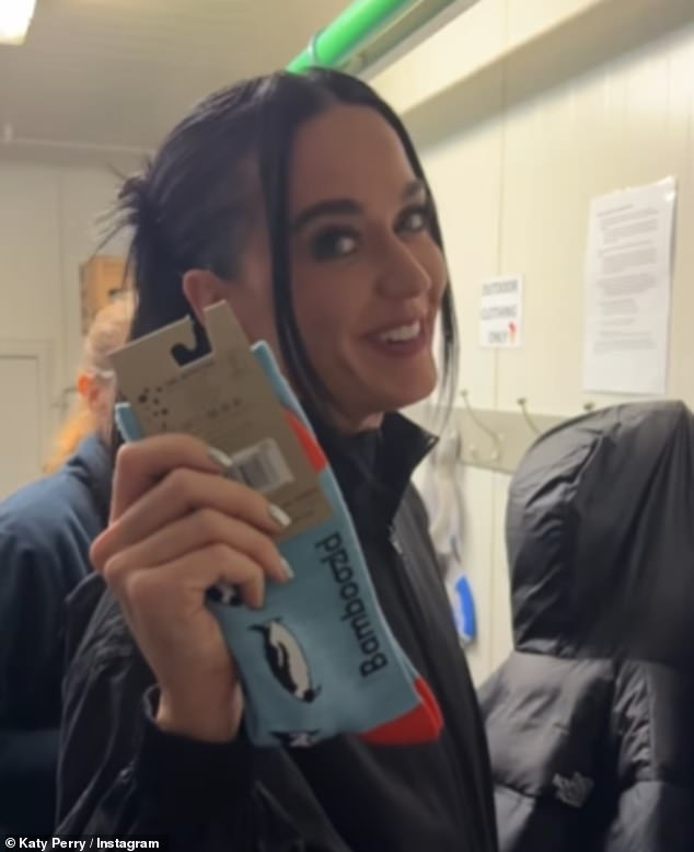 Katy Perry has sent her followers into a frenzy by sharing a clip on social media in which she teases she knows who will win the AFL Grand Final on Saturday