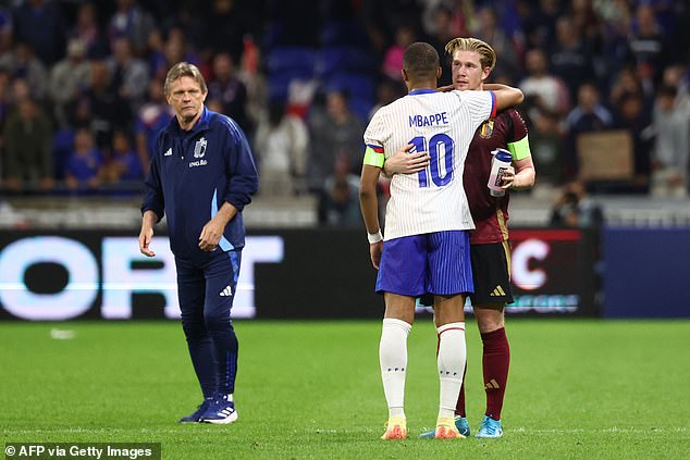 De Bruyne approached technical director Frank Vercauteren (right) and appeared to make it clear he wanted to 'quit', before leaving for France and Real Madrid player Kylian Mbappe (centre)