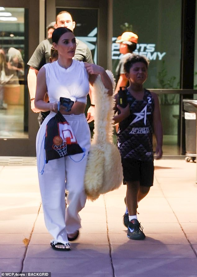 Kim Kardashian was spotted at her son Saint's basketball game on Friday looking unusually dressed