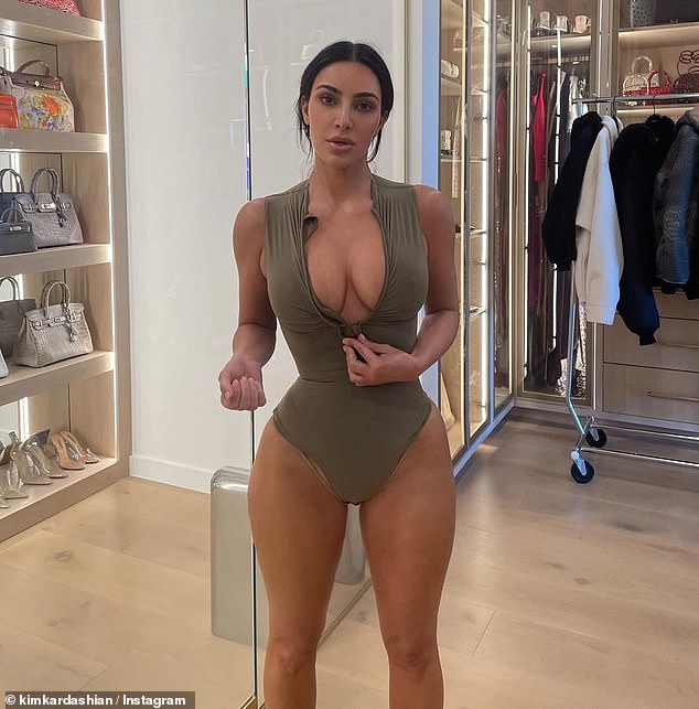 Kim Kardashian, 43, shared a sensual photo on Instagram in which she flashed her breasts and showed off her body in a tiny bodysuit on Friday