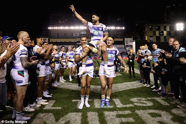 Reigning Kiwi champion Shaun Johnson is led off the field by his teammates after pulling off a stunning escape against Cronulla