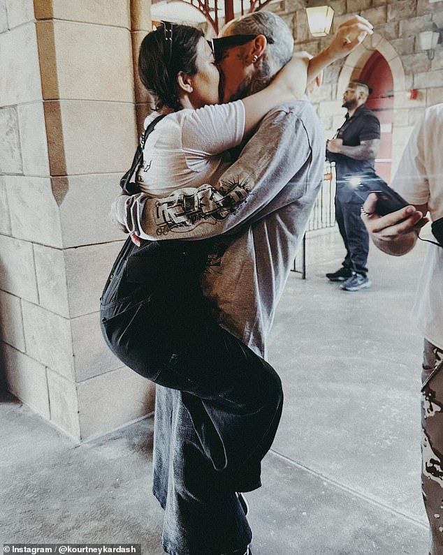 Kourtney Kardashian, 45, shared a kiss with her husband, Travis Barker, 48, in loved-up snaps she shared to her Instagram page on Friday