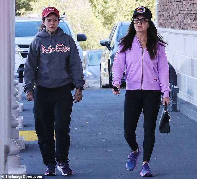 The Real Housewives of Beverly Hills star, 54, wore black leggings with blue and purple sneakers. Wade, 29, looked comfy in a gray Max Effort sweater with red and white lettering. The Wilder Day singer wore black sweatpants with navy and purple sneakers