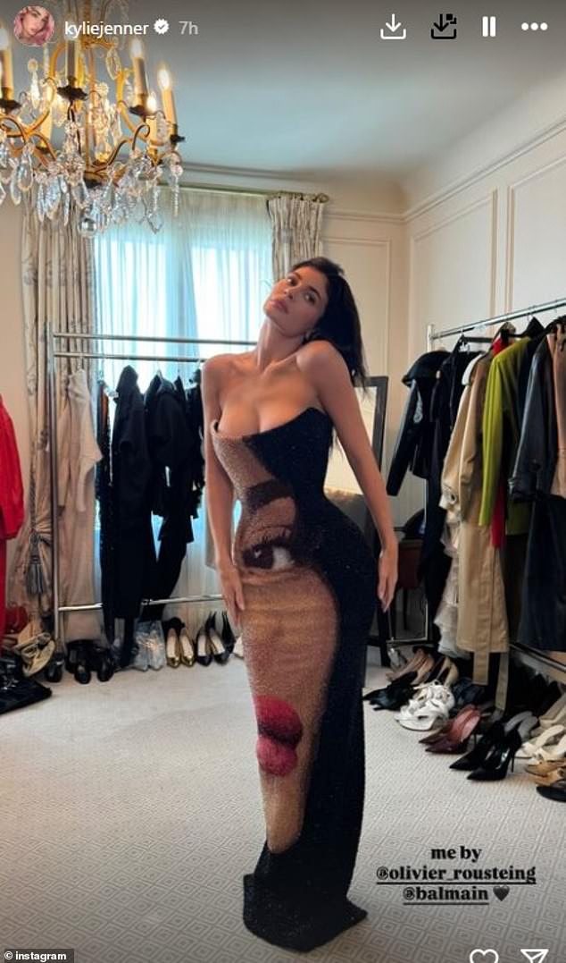 Kylie Jenner proved she's her own biggest fan when she modeled a dress with her own face on it during Paris Fashion Week