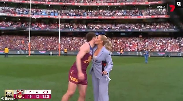 Lachie Neale and Abbey Holmes shared a polite kiss on the cheek after the AFL final