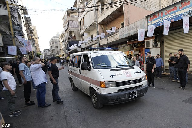 An ambulance carrying suspected wounded people after multiple explosions were heard during the funeral of four Hezbollah fighters after their mobile pagers exploded, in the southern suburb of Beirut, Lebanon, Wednesday, September 18, 2024