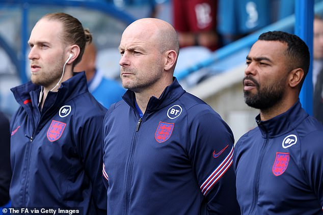 Interim head coach Lee Carsley (centre) has admitted he will not be singing the England national anthem