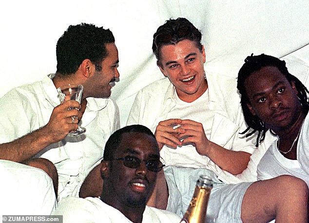 Leonardo DiCaprio (center back) and Diddy (center front) party with friends